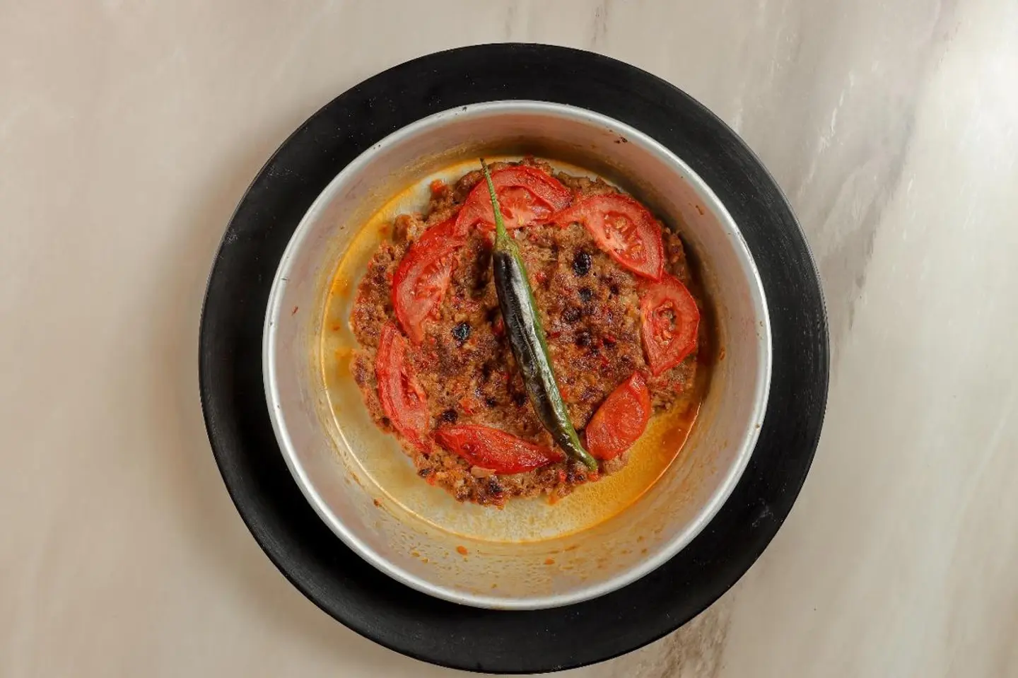 Meat On A Plate With Tomatoes