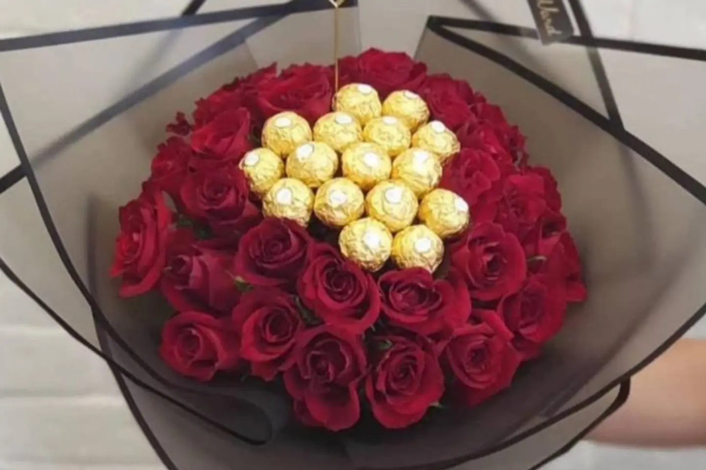 A Bouquet Of Red Roses With Chocolate Frois
