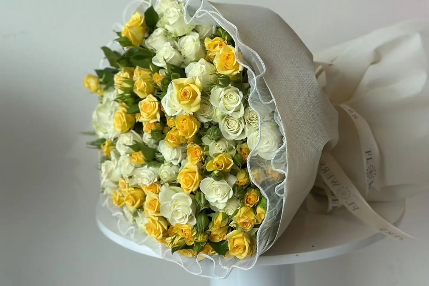 A Bouquet Of Yellow And White Spray Roes