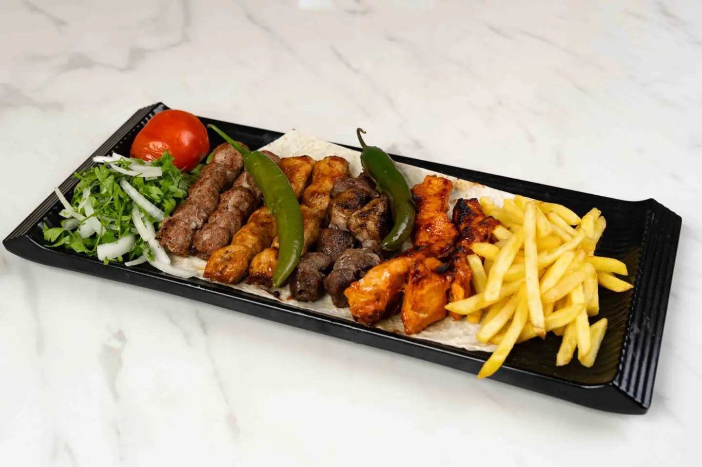 1 Kilo Mixed Grill 4 Beef Kebabs, 4 Chicken Kebabs, 4 Shish Tawook, 4 Lomi Beef Tikka