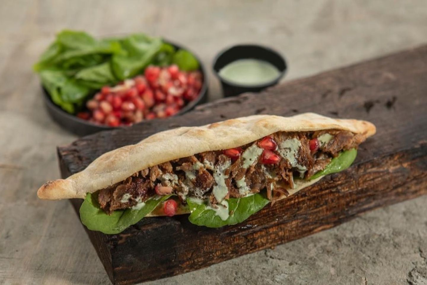 Meat With Arugula, Pomegranate And Tahini
