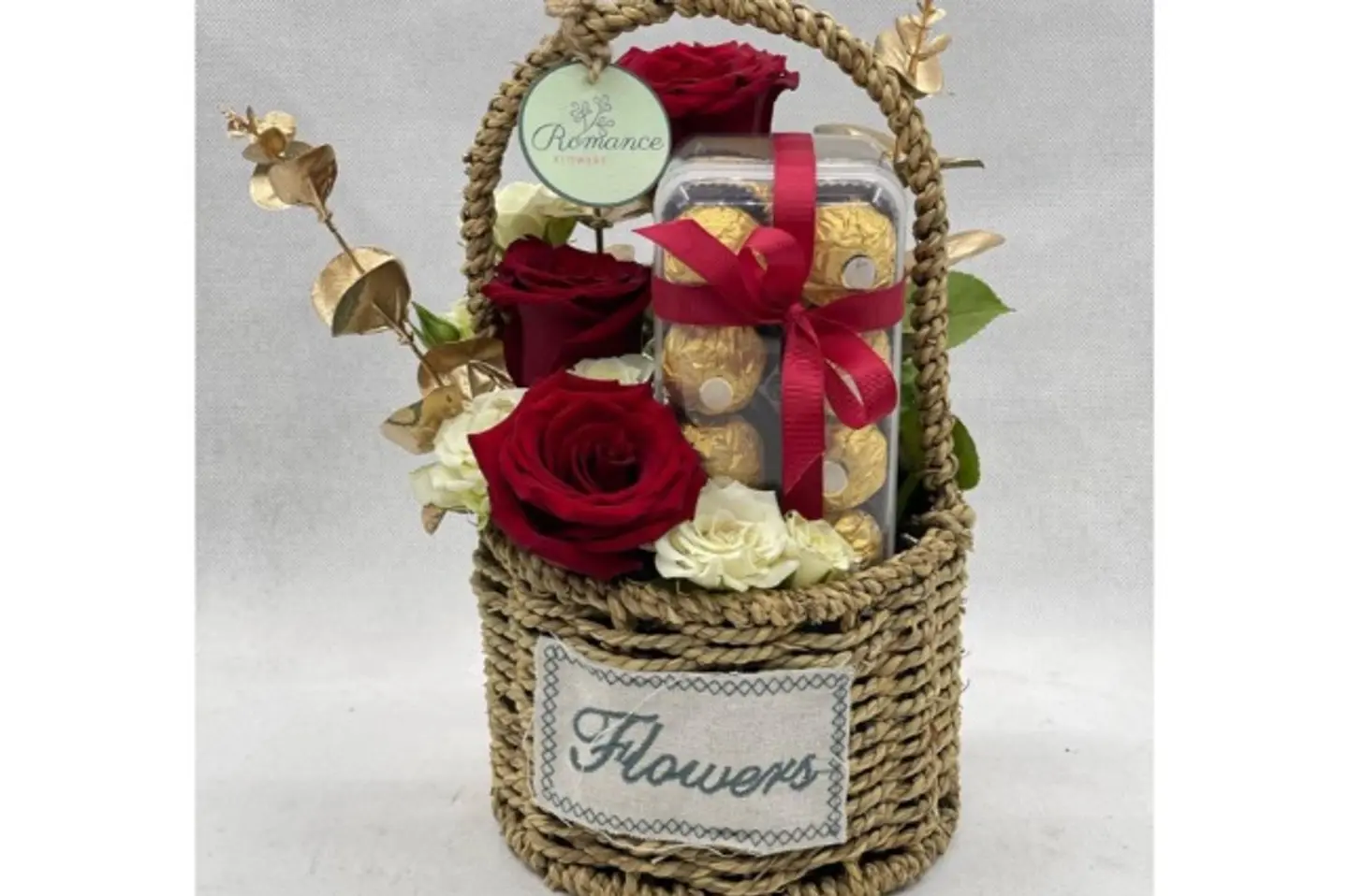 A Basket Of Roses With Rocher Chocolates