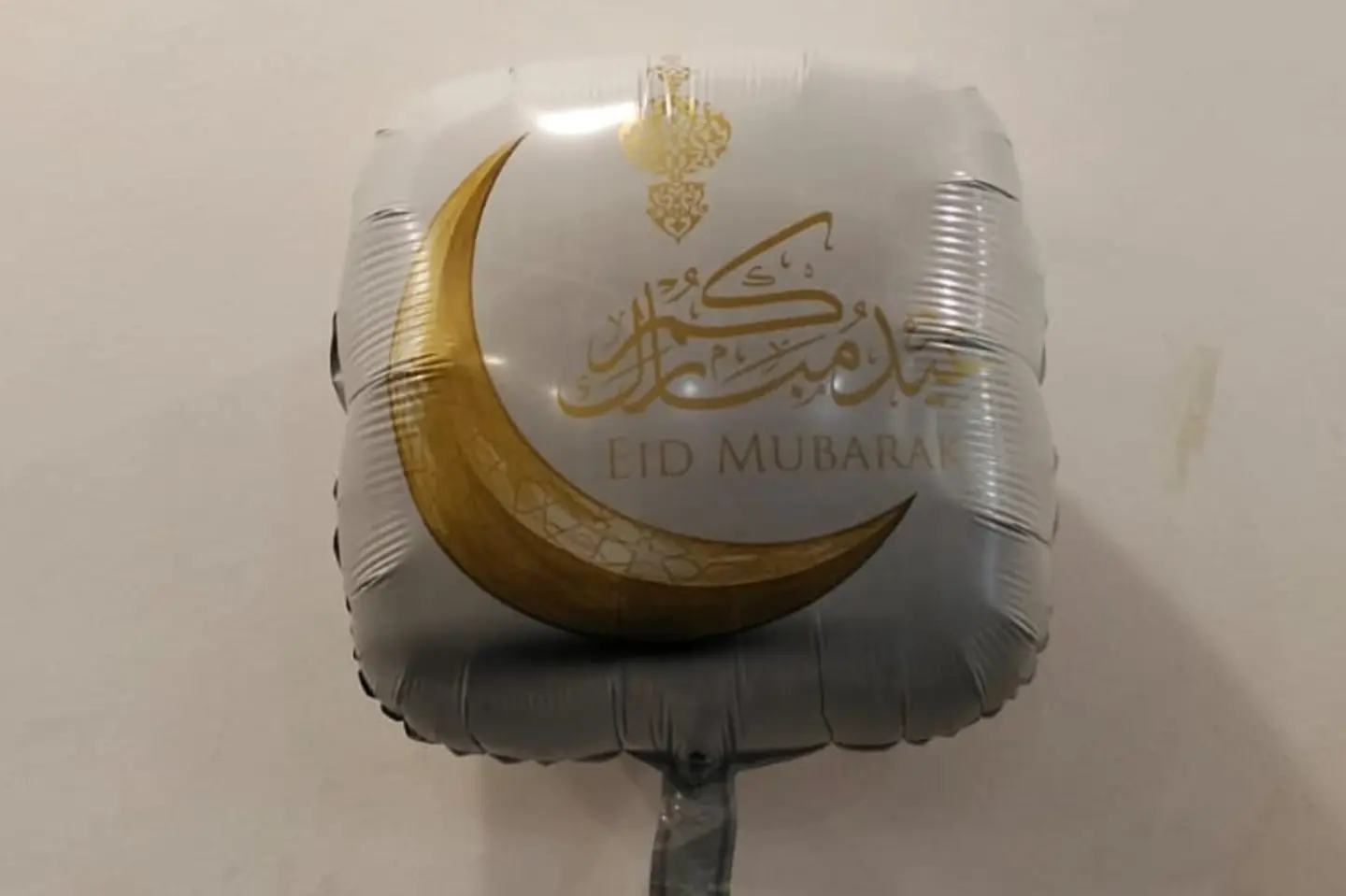 A Tin Bouquet With The Words Eid Mubarak Written On It