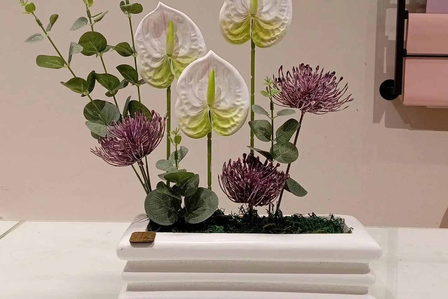 A Vase With Artificial Roses