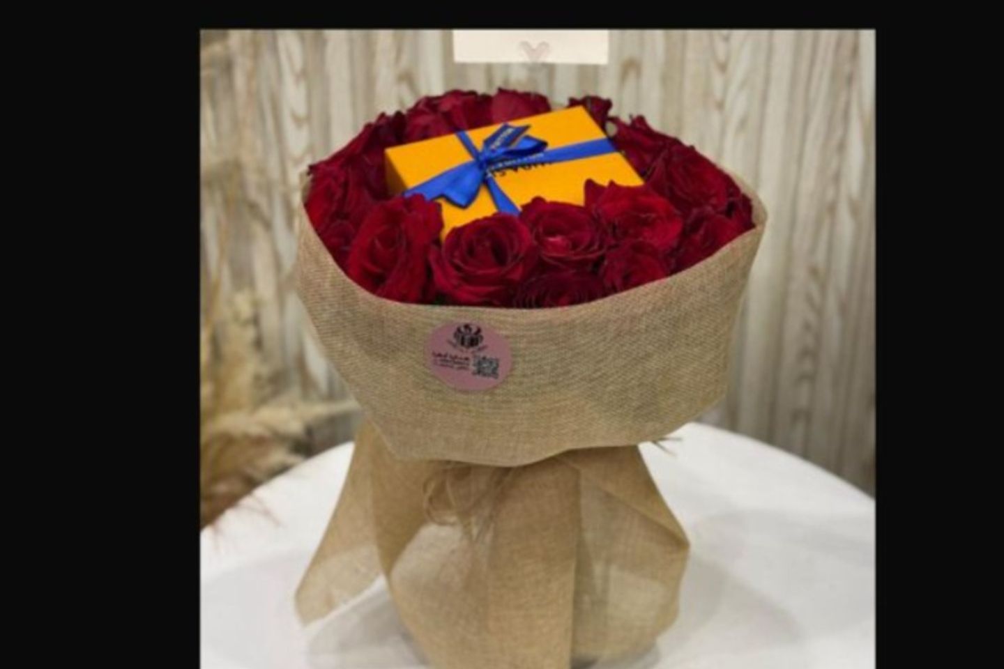 Louis Vuitton Chain In The Middle Of A Bouquet Of Red Roses