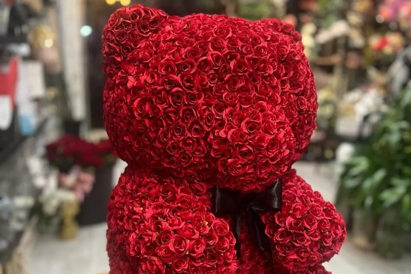 A Teddy Bear Covered With Roses
