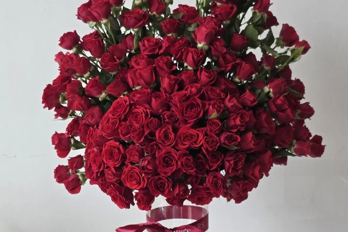 A Vase Of Red Spray Roes