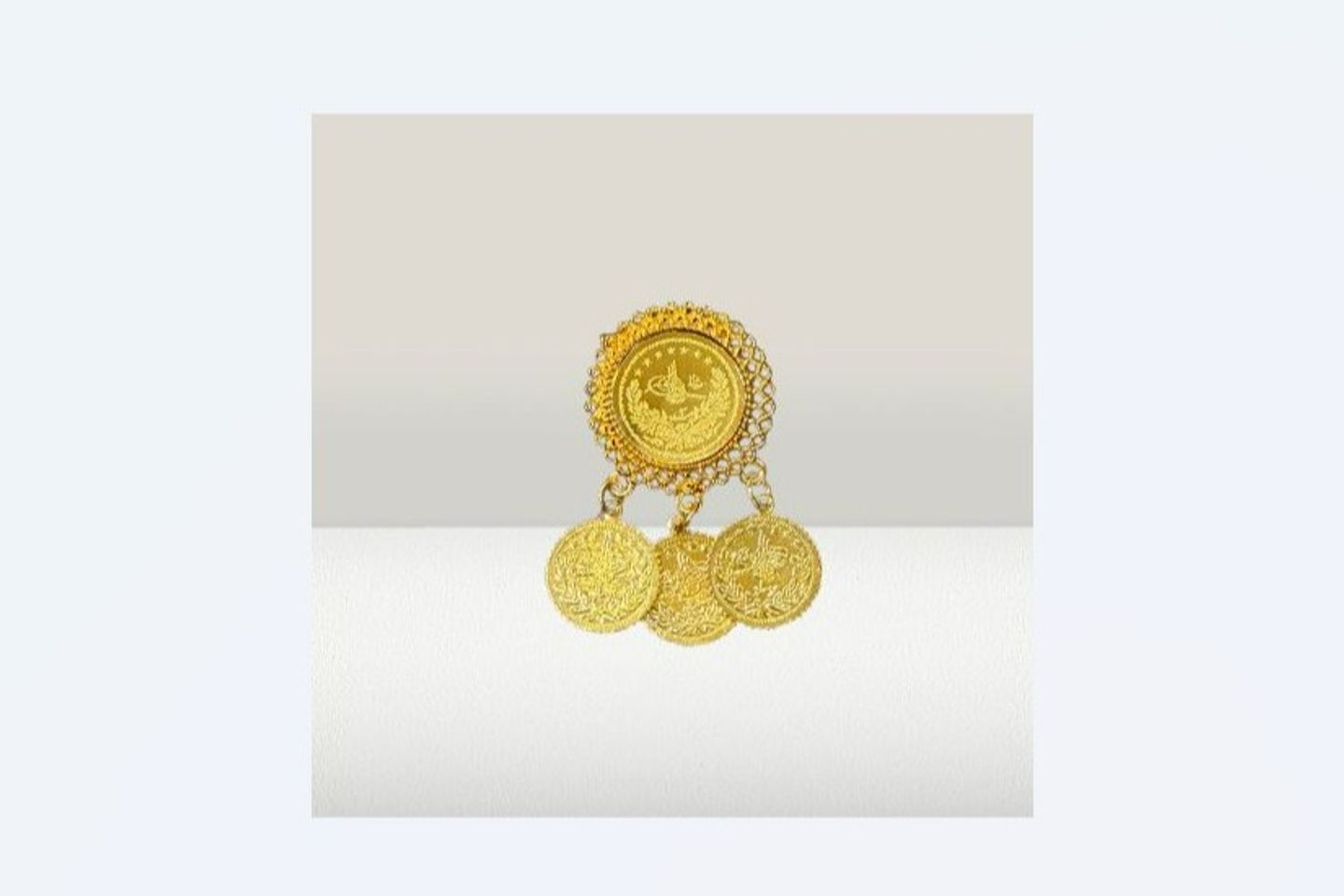 Gold Pound Brooch