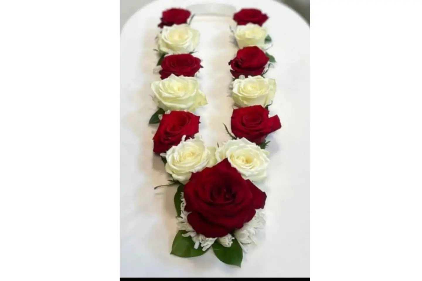 A Rose Necklace With A Ribbon