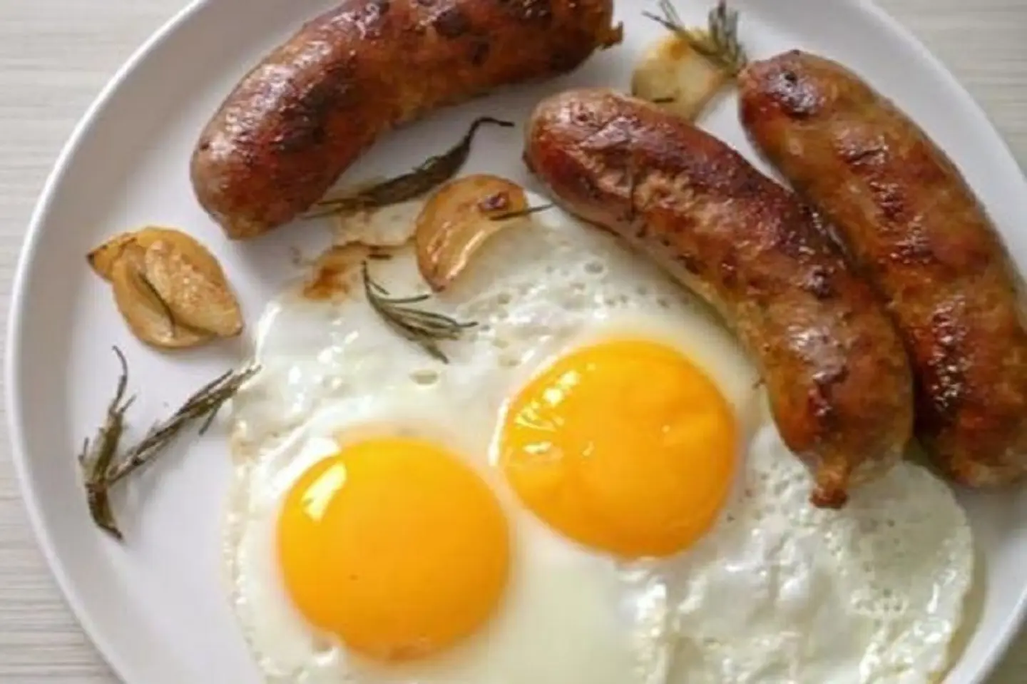 Two Fried Eggs With Sausage