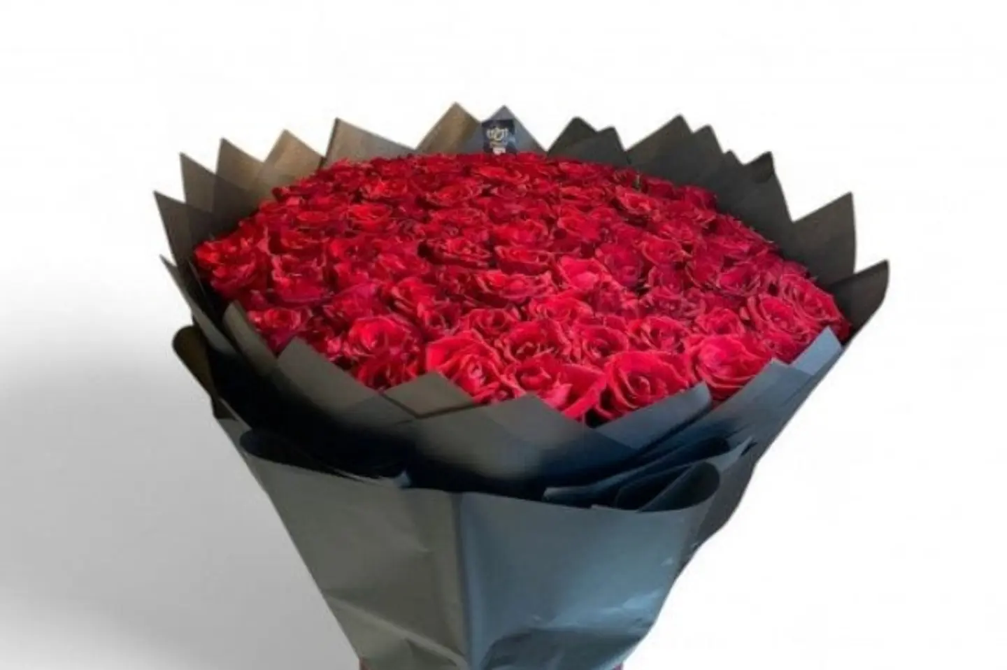 A Large Bouquet Of Red Roses Black Wrapping