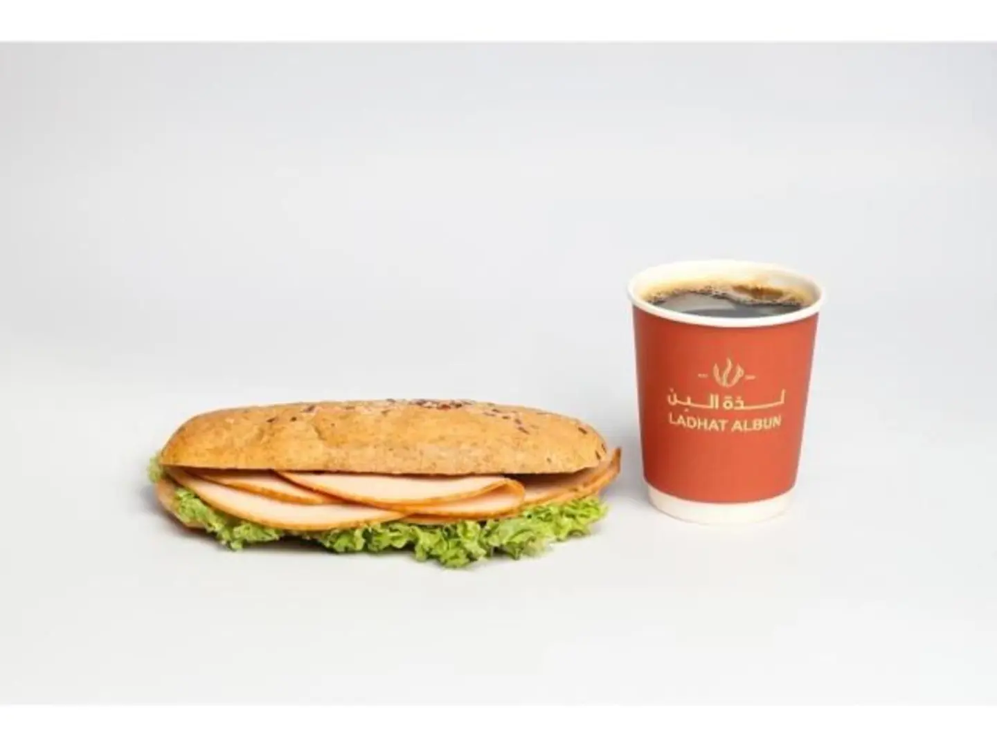 Turkey Sandwich Served With Coffee Of The Day And Water