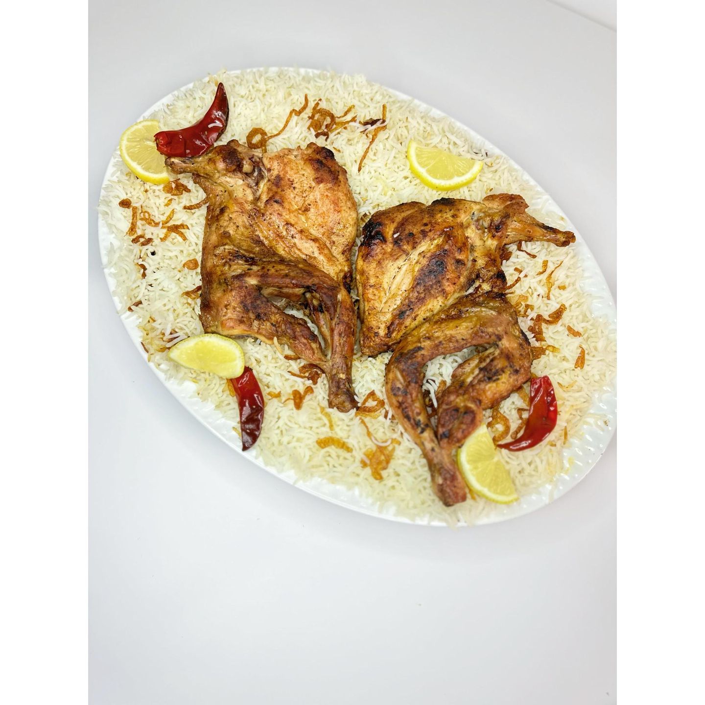نص حبة  دجاج مظبي مع رز بيشاور