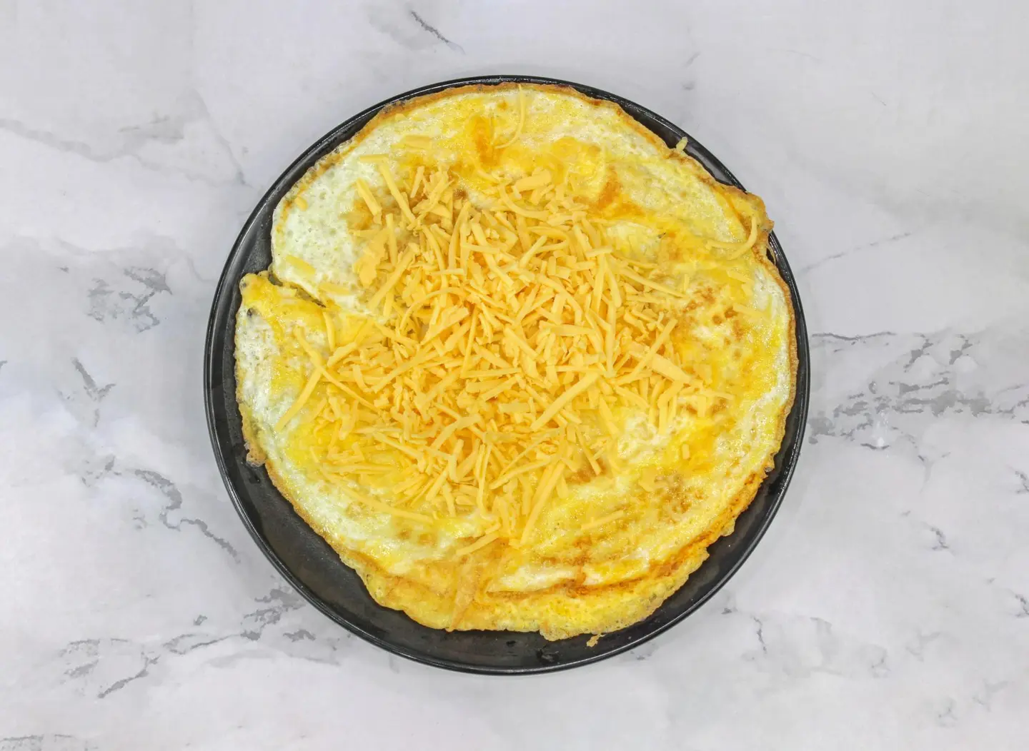 Fried Eggs With Cheddar Cheese