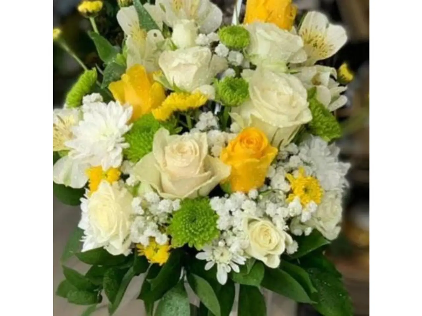 Mixed Flower Arrangement With A Large Vase
