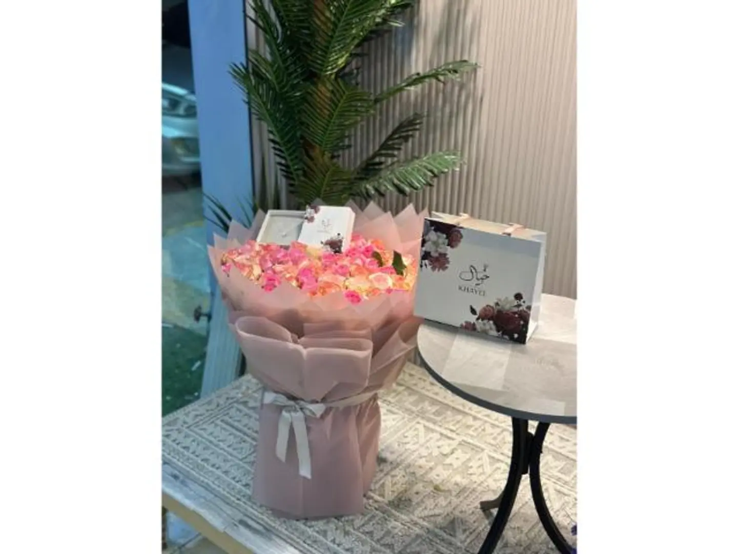 A Bouquet Of Roses With A Necklace From Khayal Bank