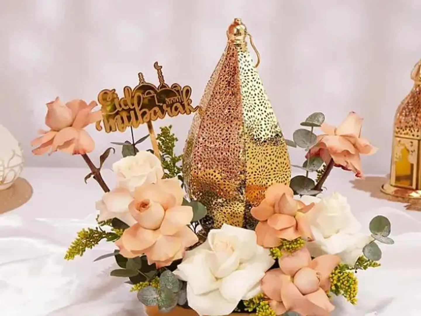 A Bouquet Of Roses And A Holiday Topper