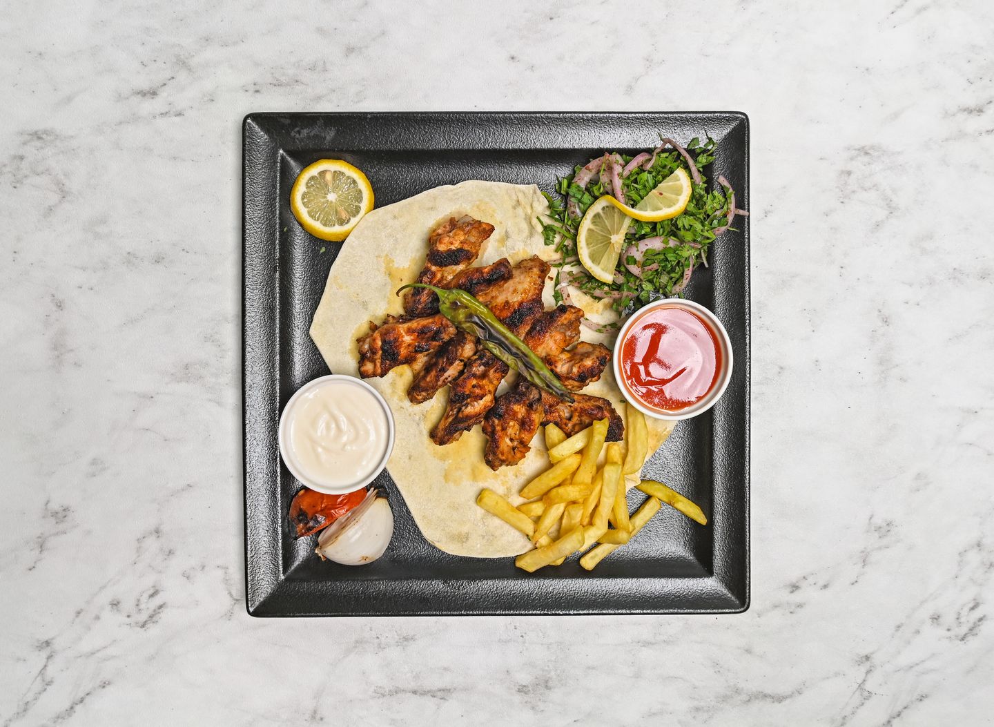 Four Skewers Of Chicken Wings