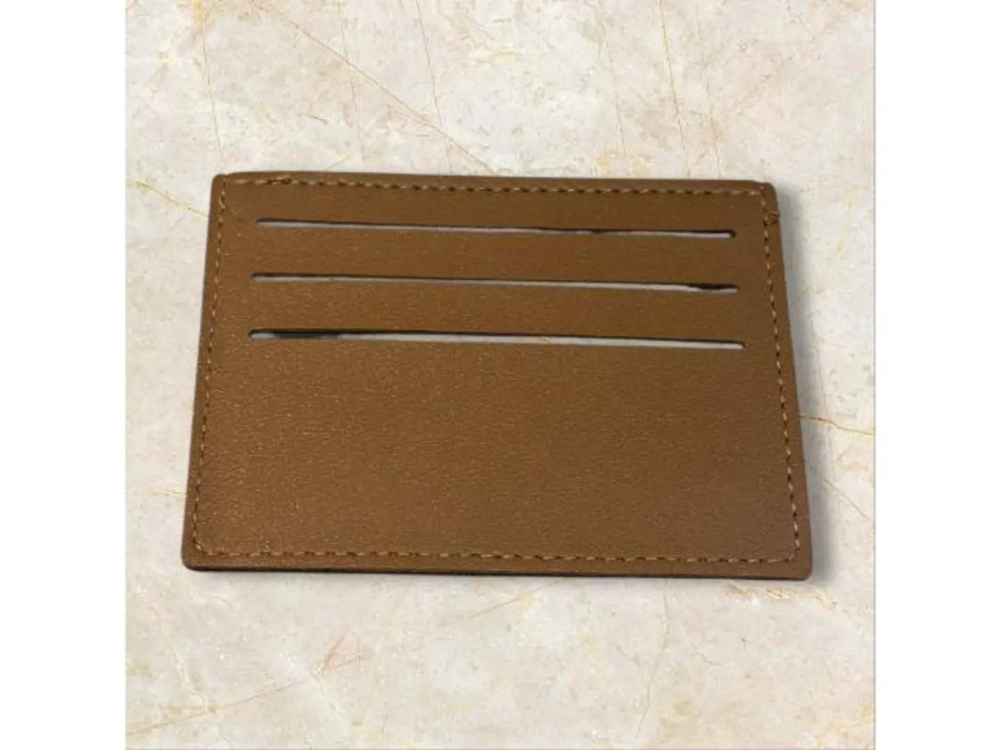 محفظه بني جلد مع نحت الاسم