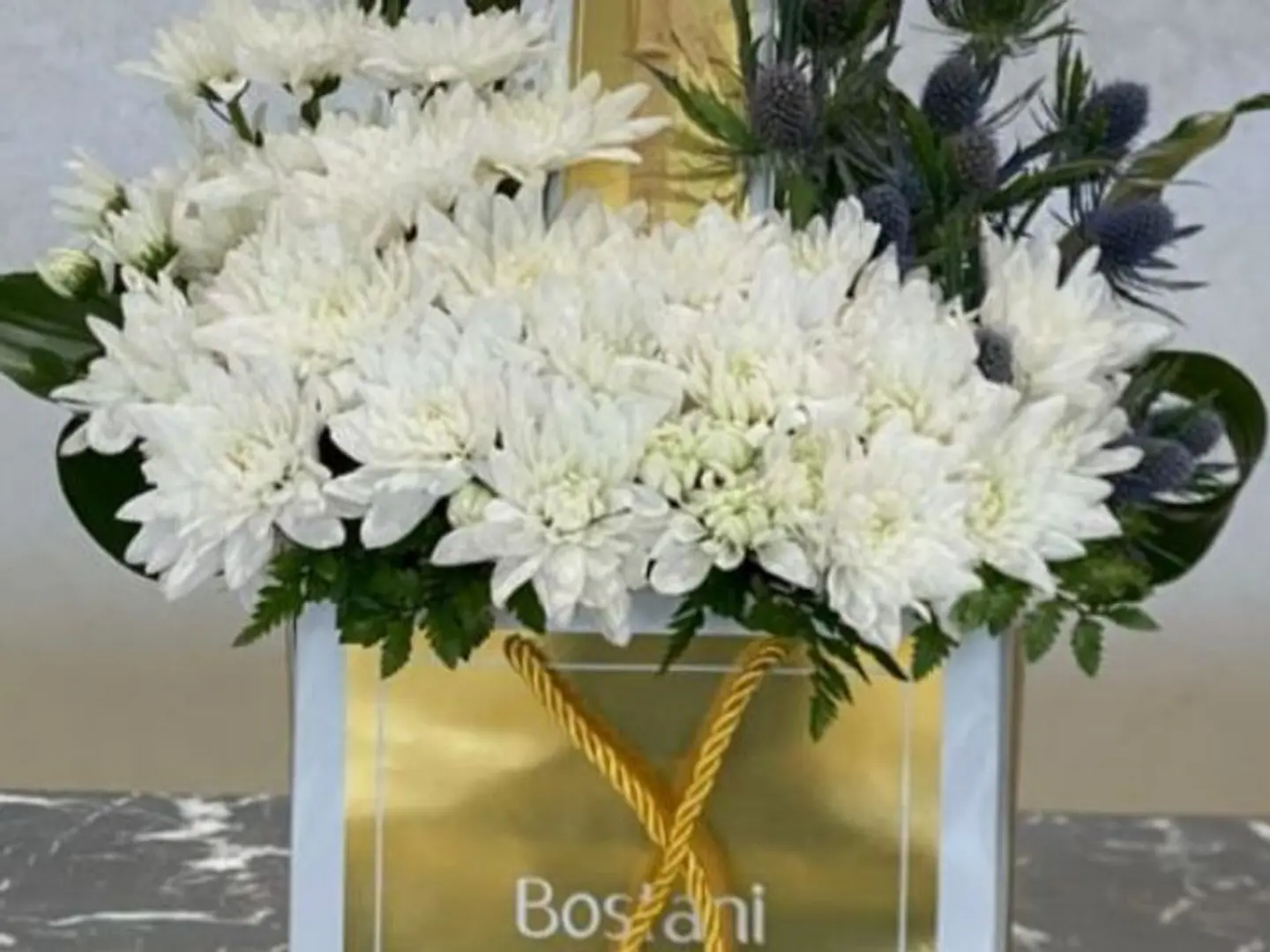 A Quarter Of Bostani Sweets With White Cherry Flowers