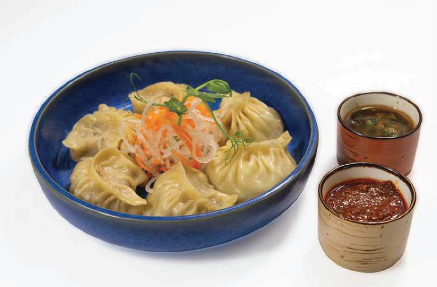 Szechuan Chicken Momo In Cheese