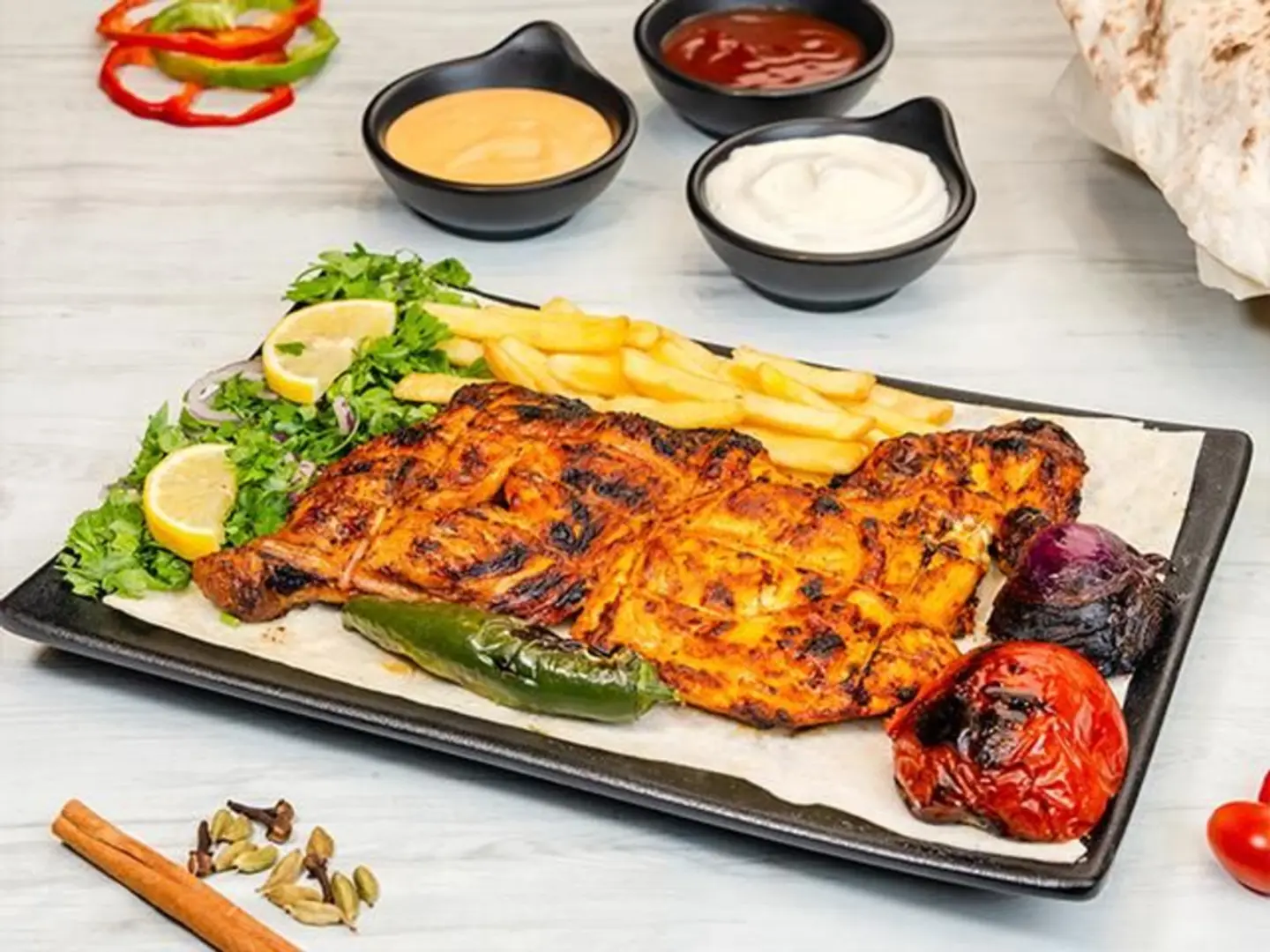 Half A Chicken On Charcoal With Potatoes