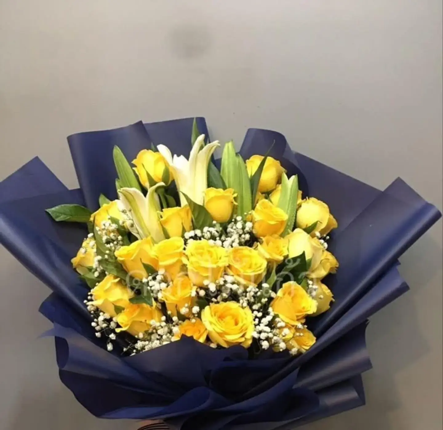 Yellow And Casablanca Bouquet With Navy Wrapping