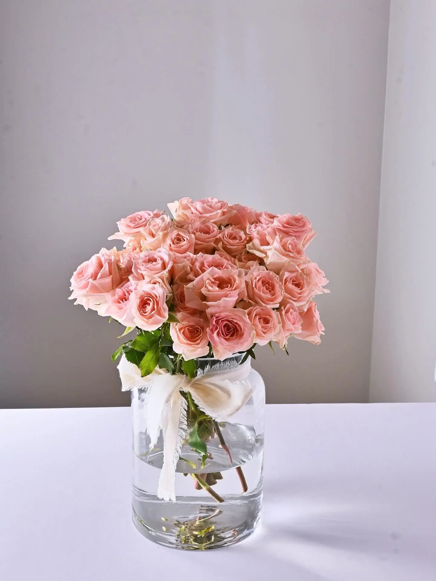 Glass Vase With Flowers And Ribbon
