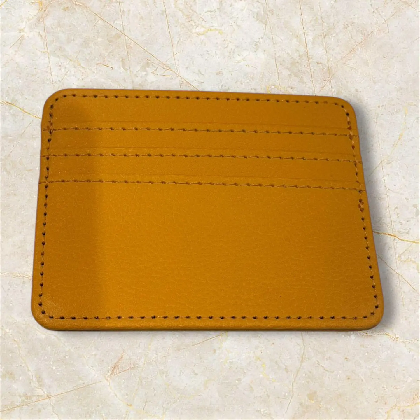 محفظه بني جلد مع نحت الاسم٣