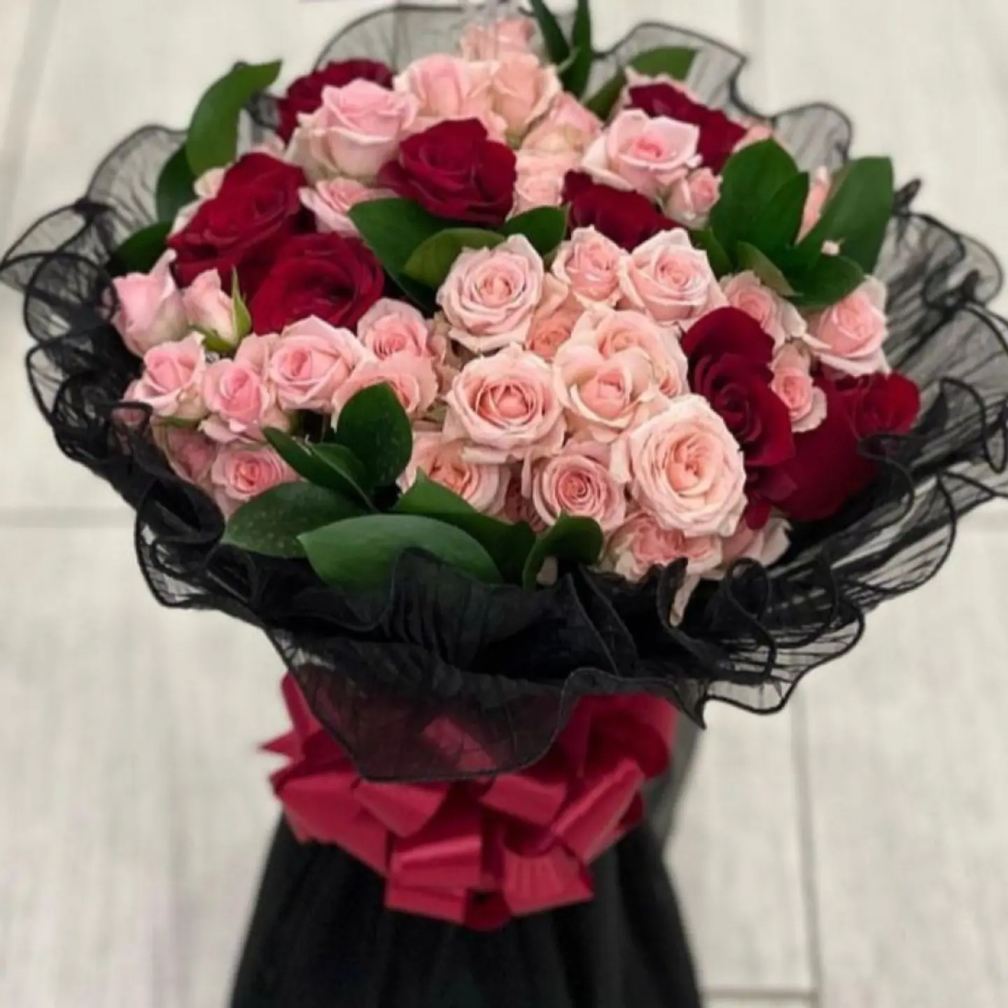 Bouquet Of Roses In Black Fabric Wrapping