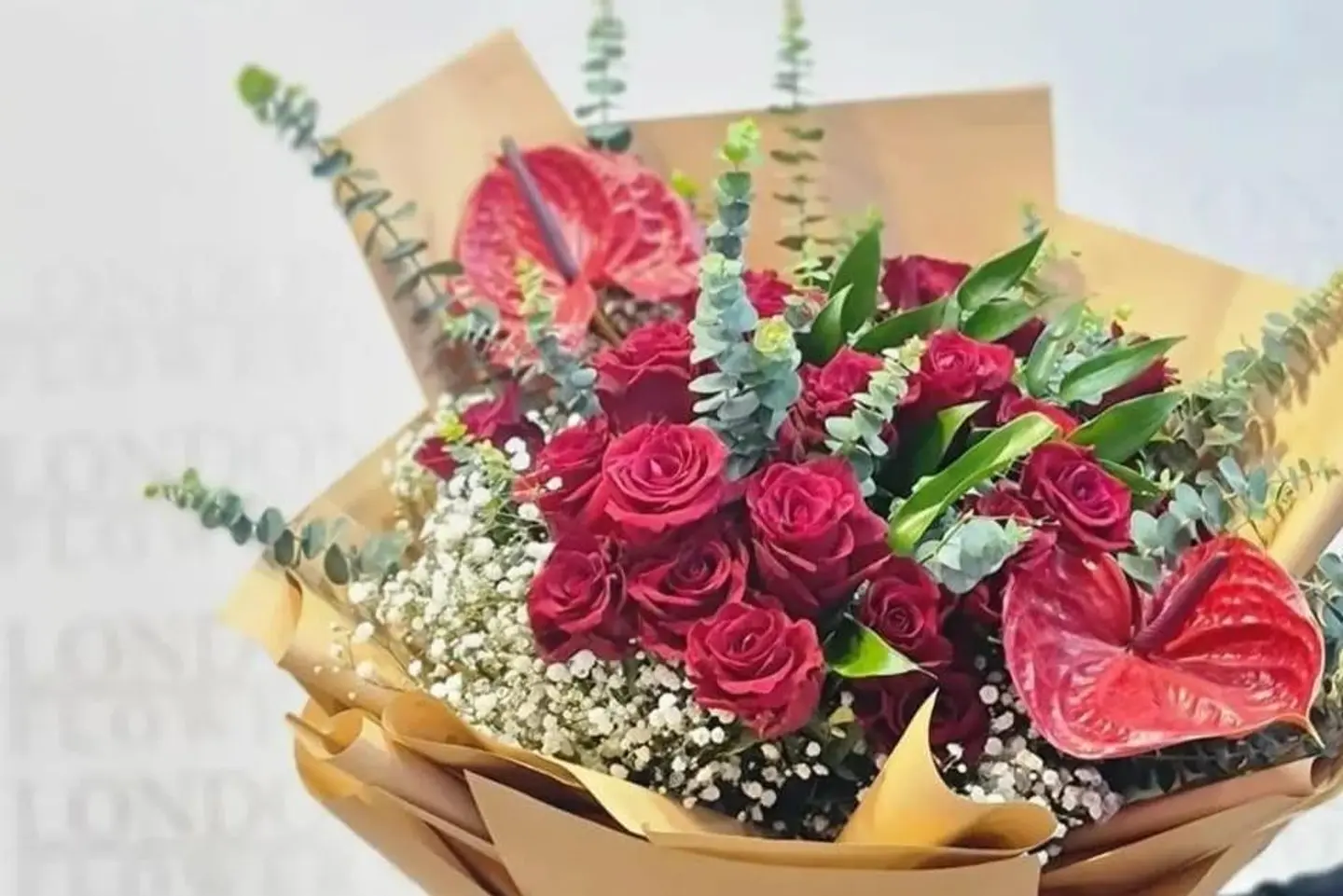 Anthurium And Rose Bouquet With Paper Wrapping