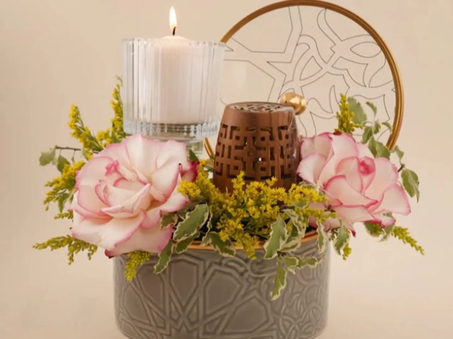 An Elegant Vase Of Roses With Incense And A Candle