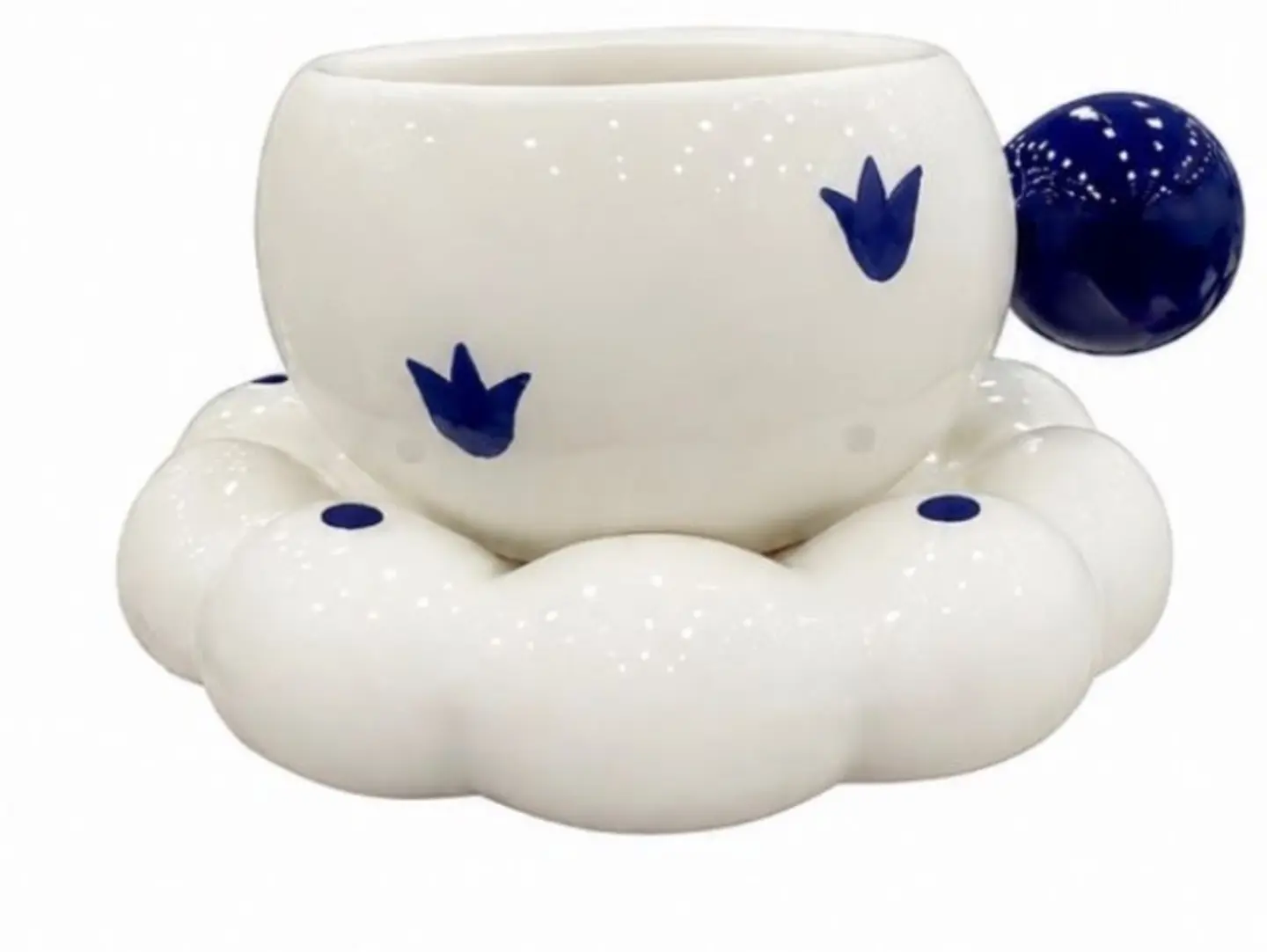 Ceramic Cup And Saucer Set With A Cloud Design; The Cup Is White And Blue.