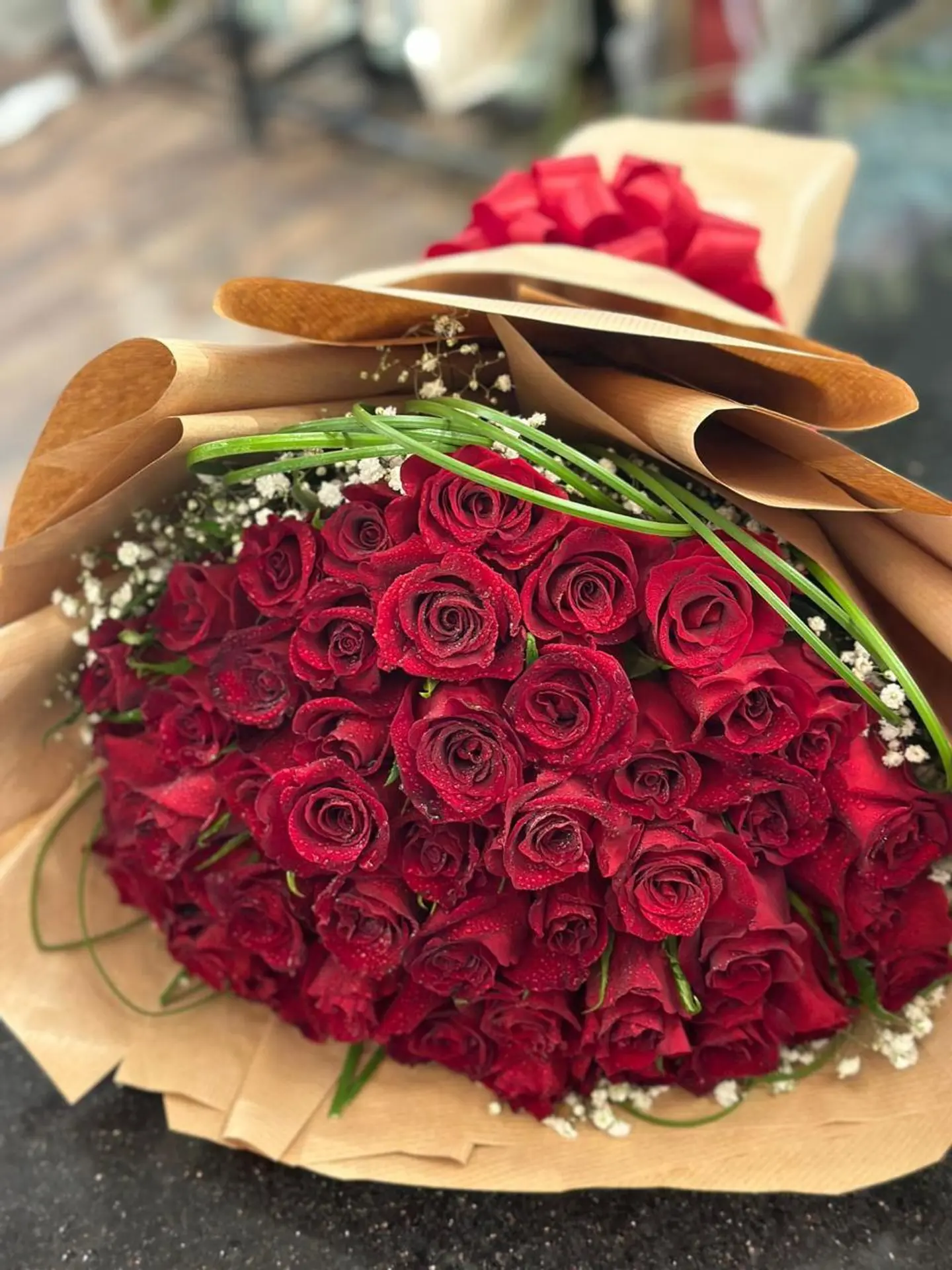 50 Red Roses Bouquet With White Jipso And Still Grass Leaf