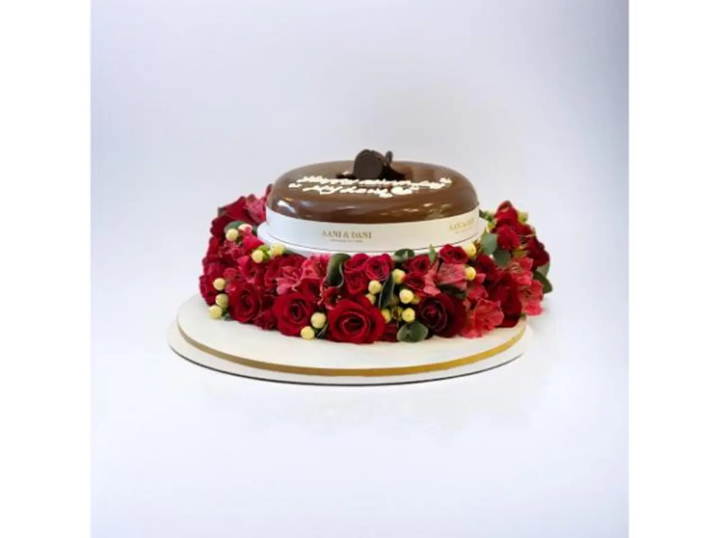 A Rose Arrangement With Chocolate Cake