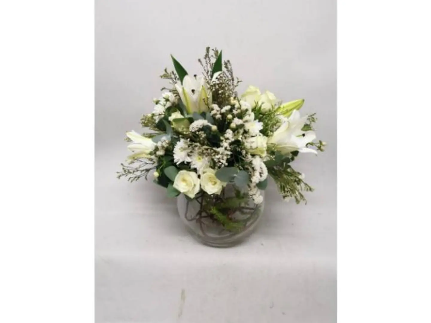 A Bouquet Of White Roses In A Vase
