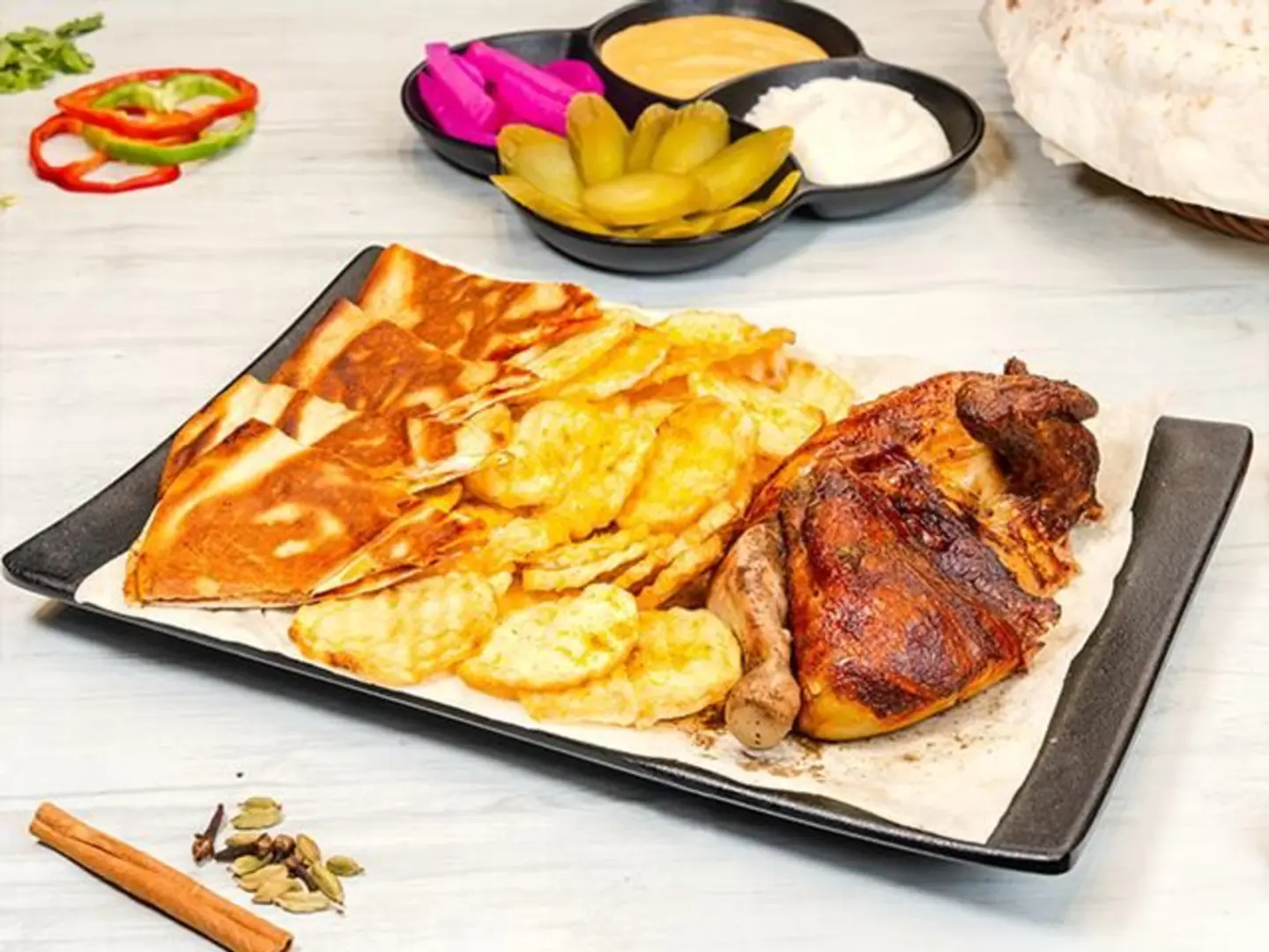 Half A Grilled Chicken With Potatoes