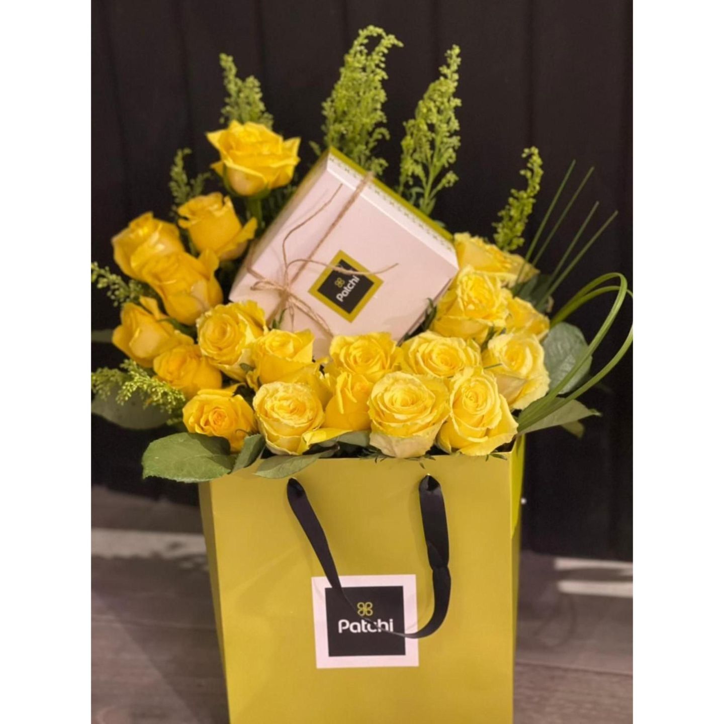 A Bouquet Of Flowers With A Quarter Kilo Of Patchi