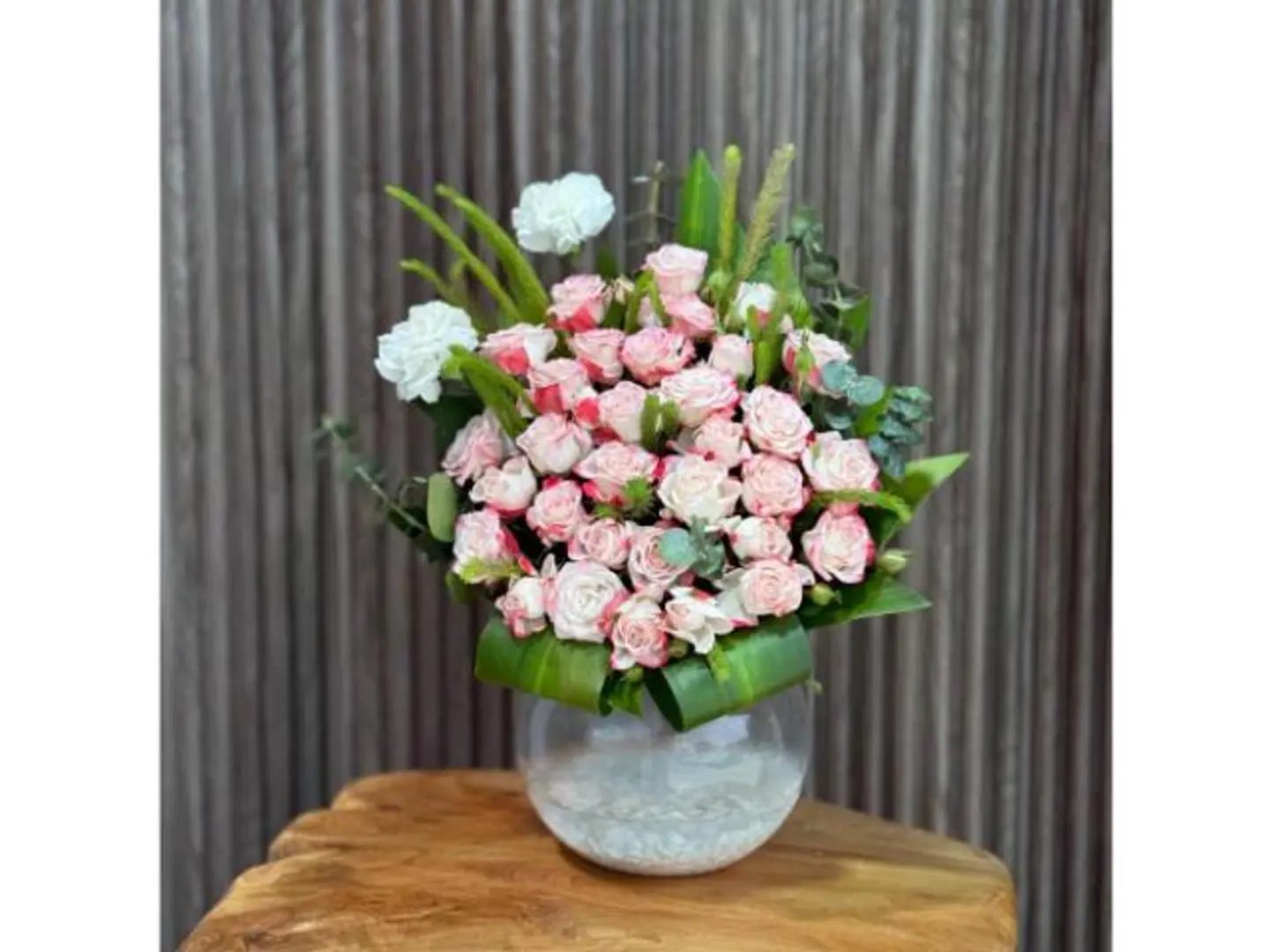 Pink Flower Arrangement In A Luxurious Glass Vase