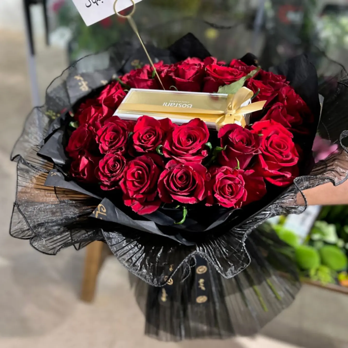 A Bouquet Of Red Roses, Black Lace Fabric Wrap And A Garden Quarter