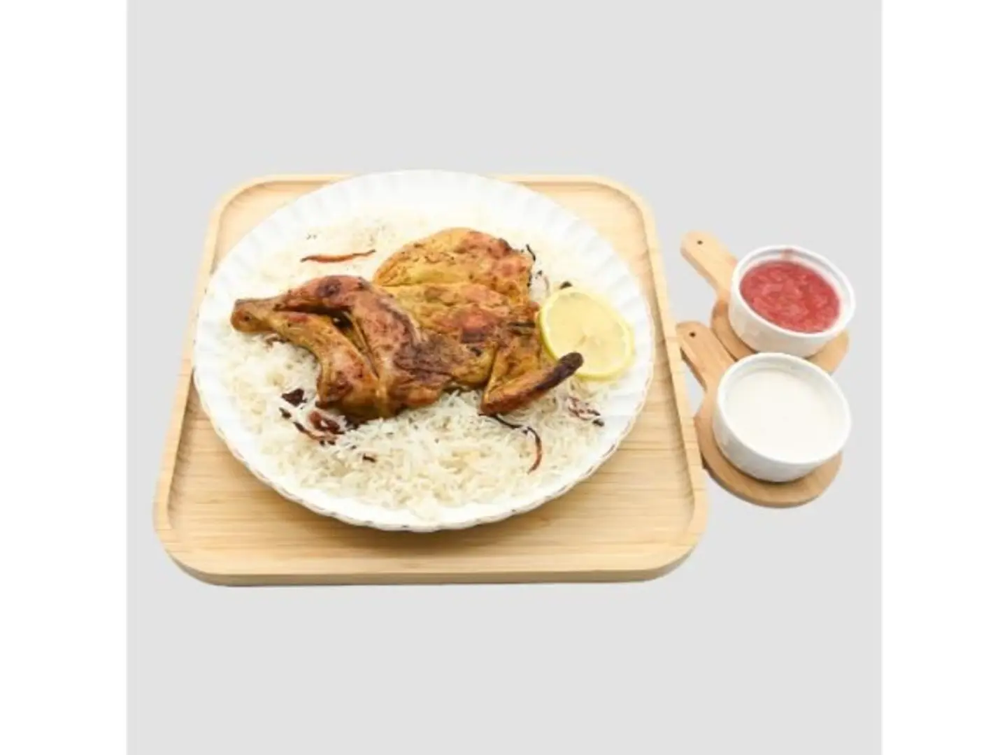 نصف حبة دجاج مظبي مع الأرز