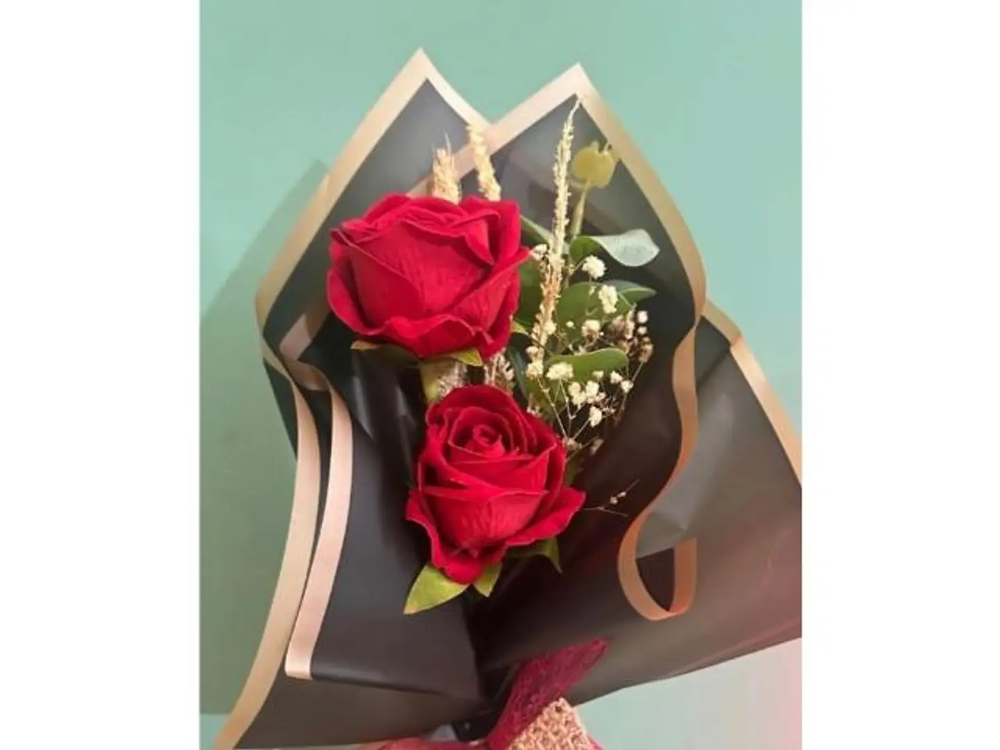 Two Red Roses With Black Wrapping