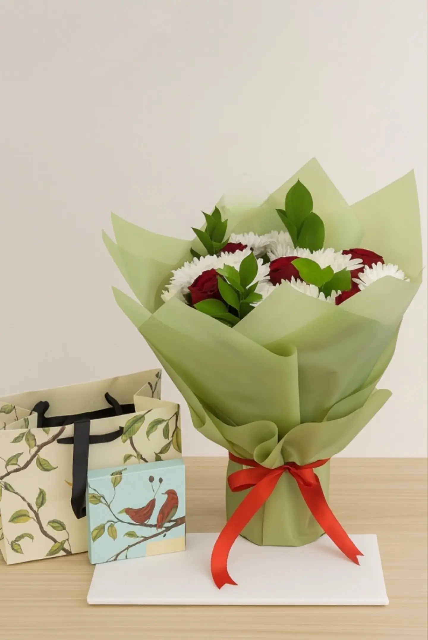 An Elegant Bouquet Of Flowers With Chocolate