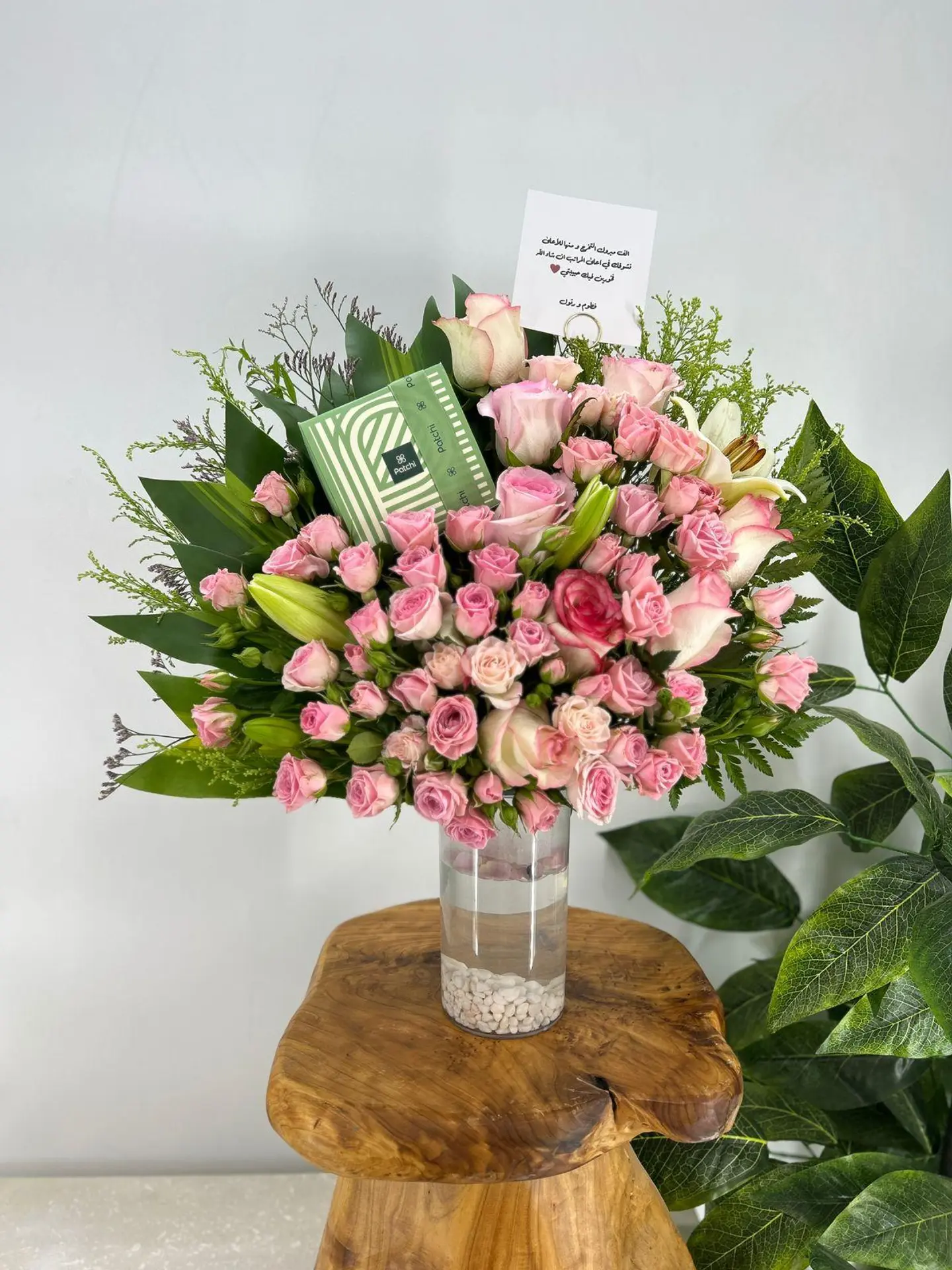 A Vase Of Pink Roses With Patchi