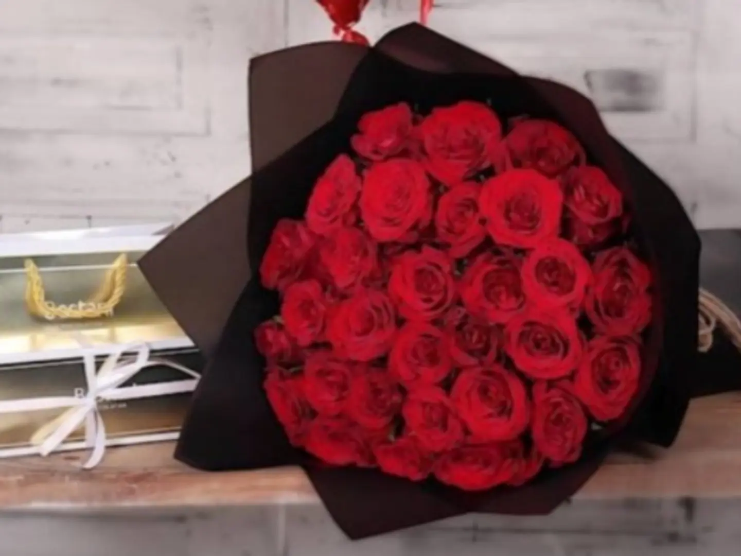 A Large Bouquet Of Roses And A Quarter Of A Gardener