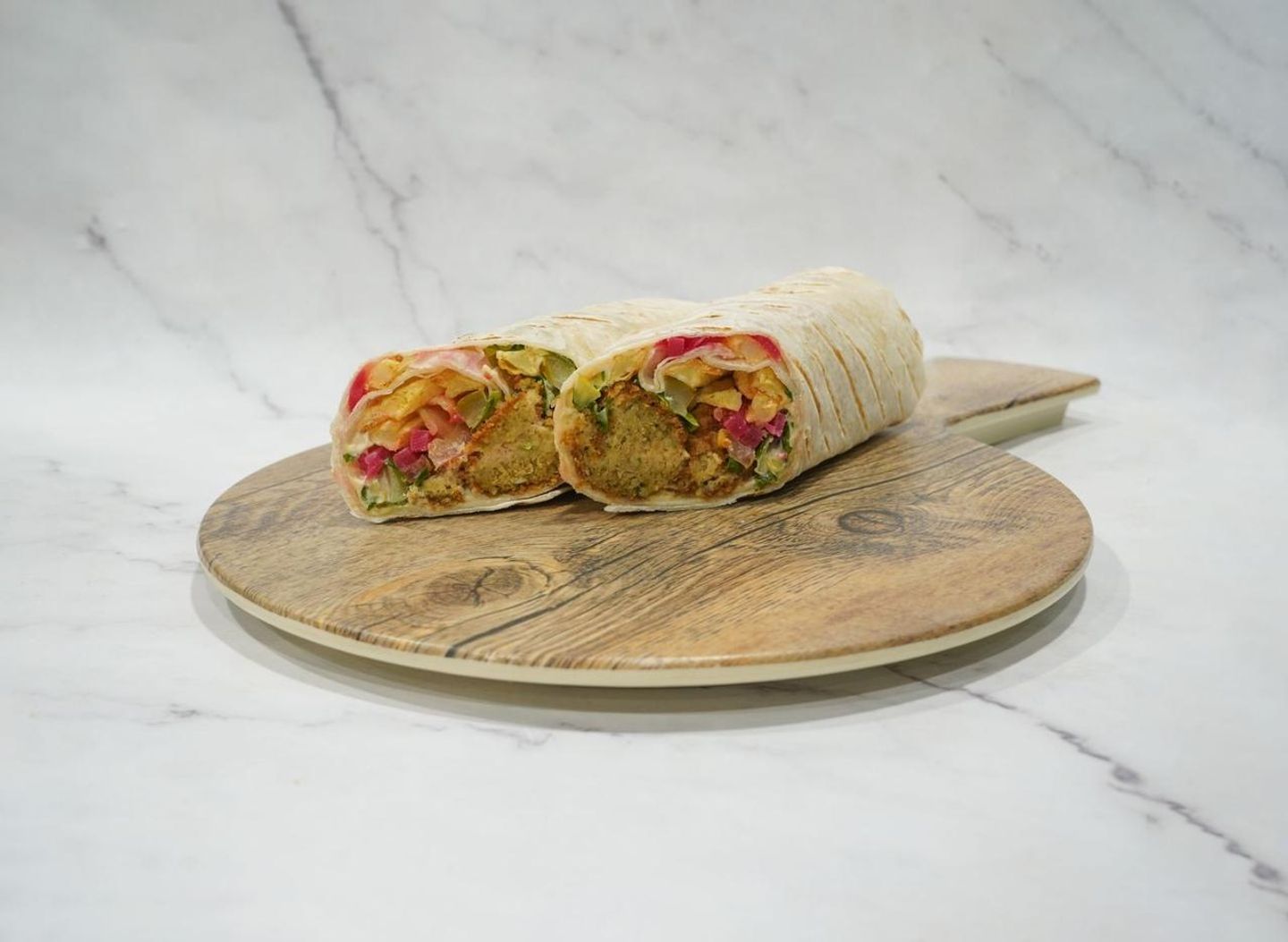 Falafel Sandwich With Egg, Potatoes, Cheese, Spicy Batal Chips, And Shoestring Fries