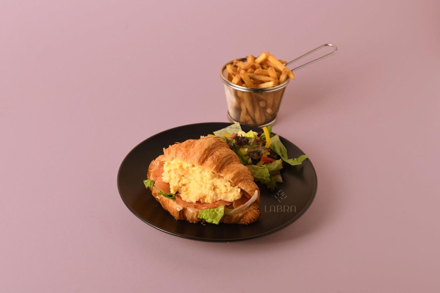 Croissant With Scrambled Eggs And Smoked Salmon Slices