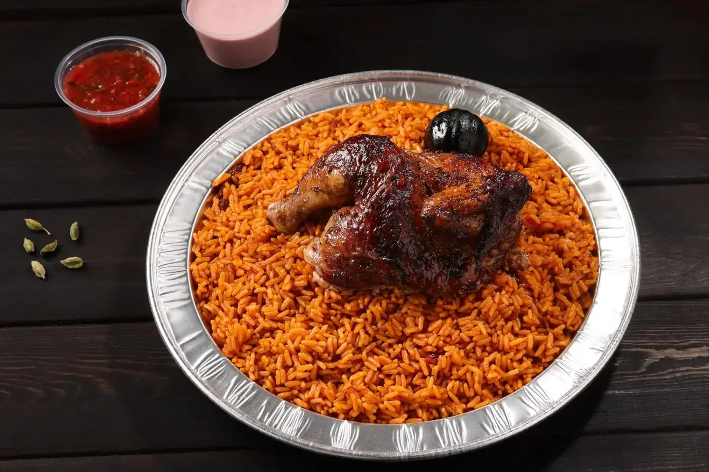 Half Wood Grilled Chicken Served With Red Rice.