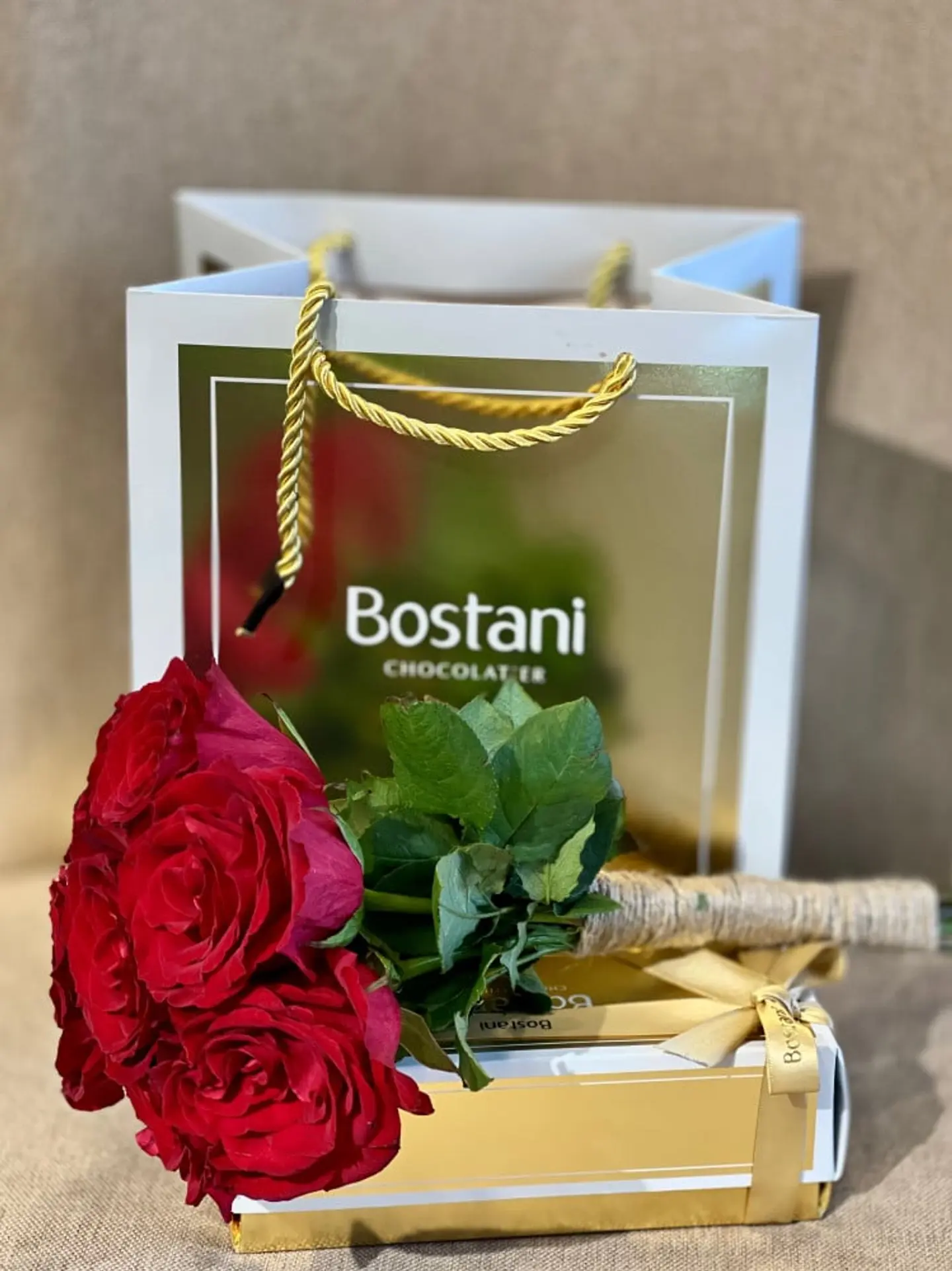 A Quarter Gardener With A Red Rose Holder And A Burlap Roll