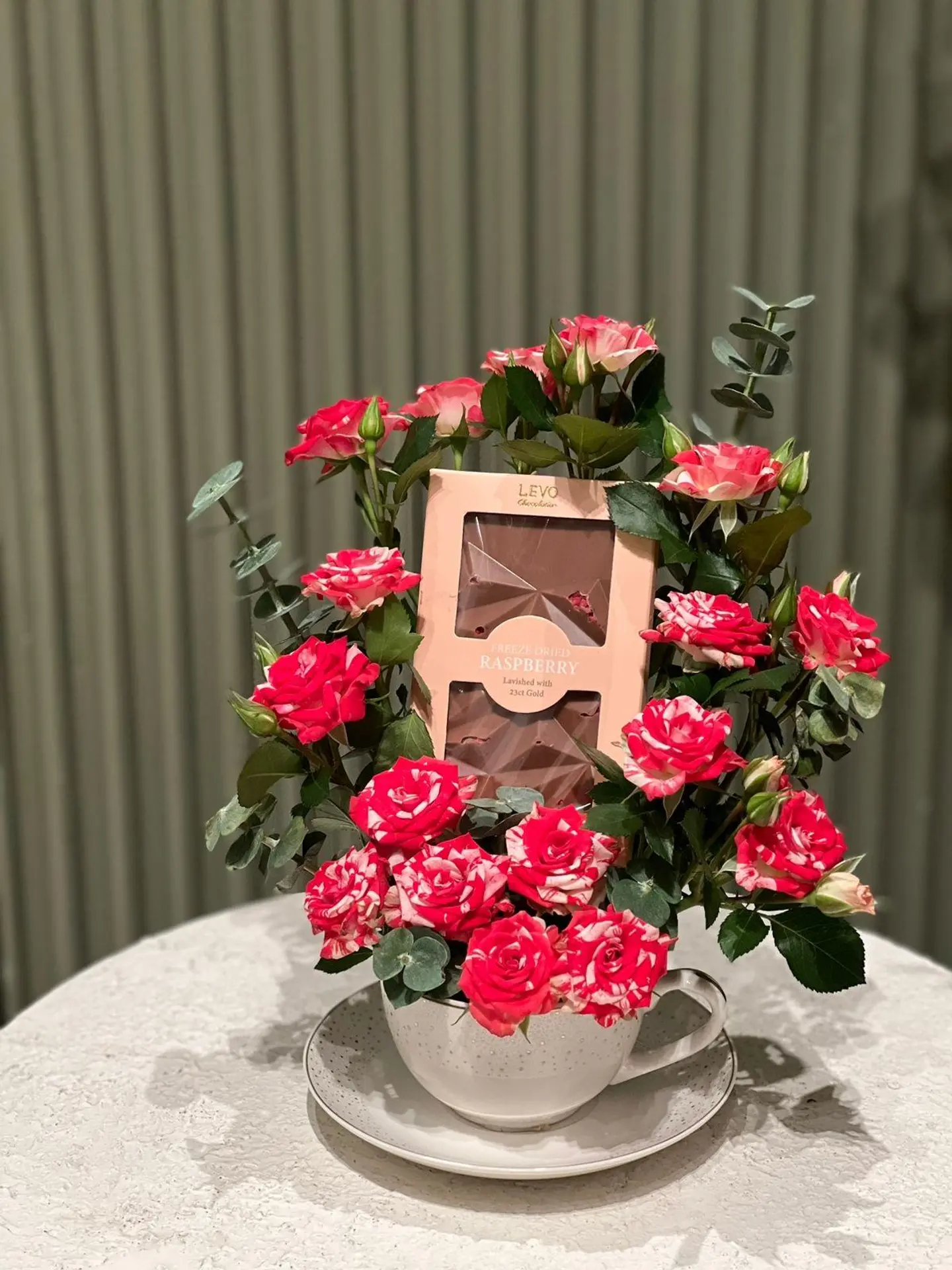A Cup Of Flowers And Livo Chocolate